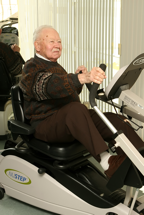 Elderly patient on exercise machine